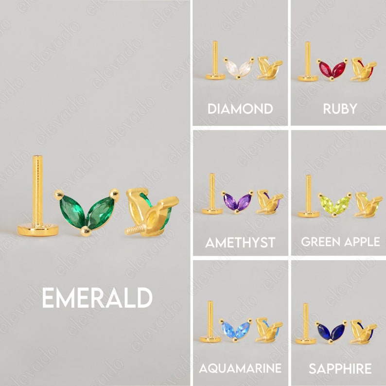 Może przedstawiać: Sześć par złotych kolczyk&oacute;w z r&oacute;żnokolorowymi kamieniami szlachetnymi. Każdy kolczyk ma parę kamieni szlachetnych w kształcie markizy osadzonych w złotej liści. Kamienie szlachetne to: diament, rubin, szmaragd, ametyst, zielone jabłko, akwamaryn i szafir.