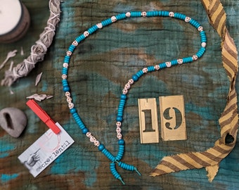 soothsayer beads necklace in aqua and teal, with skulls