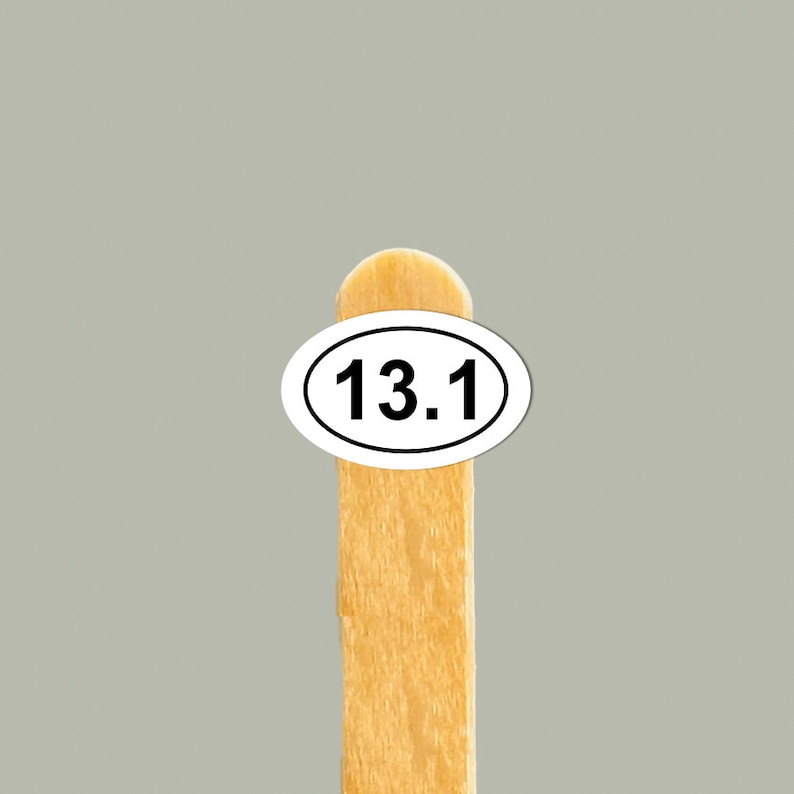 May include: A wooden stick with a white oval sticker that says "13.1" on it.