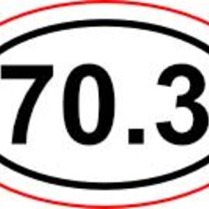 May include: Oval sticker with the number "70.3" in bold black font, centered within a black oval, which is then surrounded by a red oval border. The design is simple and clear, suitable for various applications.