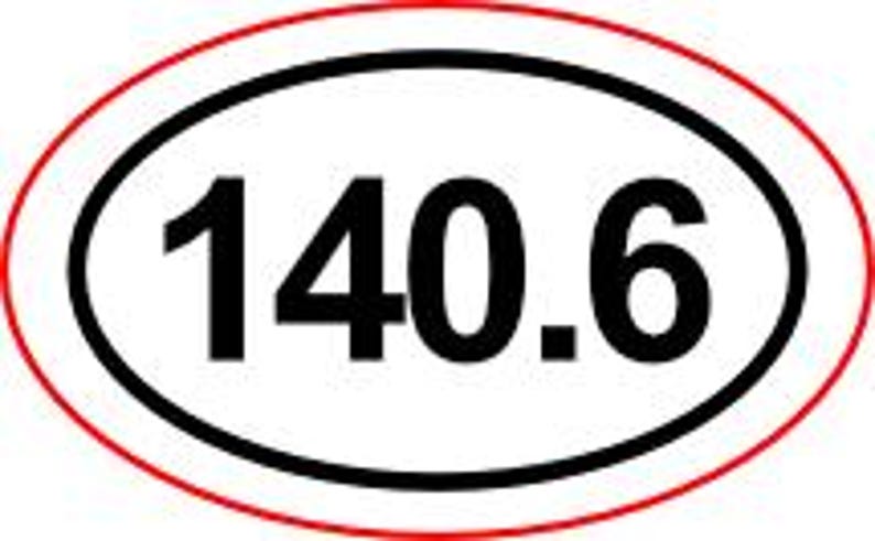 May include: An oval sticker with the number 140.6 in bold, black font. The number is centered within a black oval, which is surrounded by a red oval border. The sticker is likely for a vehicle or equipment.