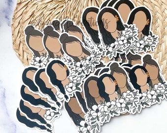 May include: A set of 10 illustrated stickers featuring women with long dark hair and floral accents. The stickers are printed on white paper and have a matte finish.