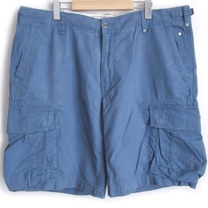 May include: Blue cargo shorts with multiple pockets. The shorts have a relaxed fit and are made of a lightweight fabric.