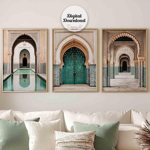May include: Three framed prints showcasing arched doorways with detailed designs and teal doors. The prints are hung above a white sectional sofa with cushions in white and green hues. The room has a neutral colour scheme and a relaxed atmosphere.