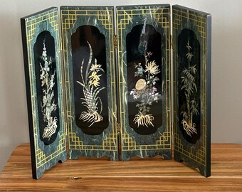 A four‑panel Chinese black‑lacquer screen with mother‑of‑pearl florals, TABLETOP decorative accent, LACQUERWARE, modern minimalism