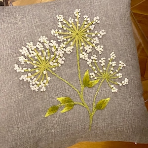 Throw pillow cover with hand embroidered dandelion flowers and leaves