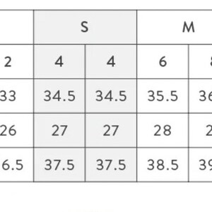 May include: Size chart for women's clothing with measurements in inches for bust, waist, and hip. The chart includes sizes XXS to XL, with corresponding dress sizes and measurements.