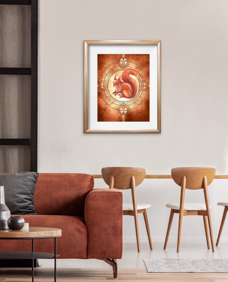 May include: A framed illustration of a red squirrel sitting inside a gold geometric circle on a brown background.