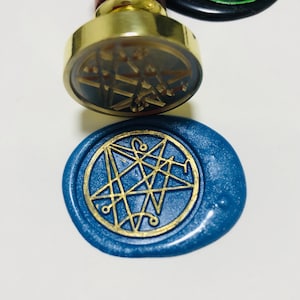 the Necronomicon seal wax stamp from Cthulhu Mythos, Call of Cthulhu, Lovecraft