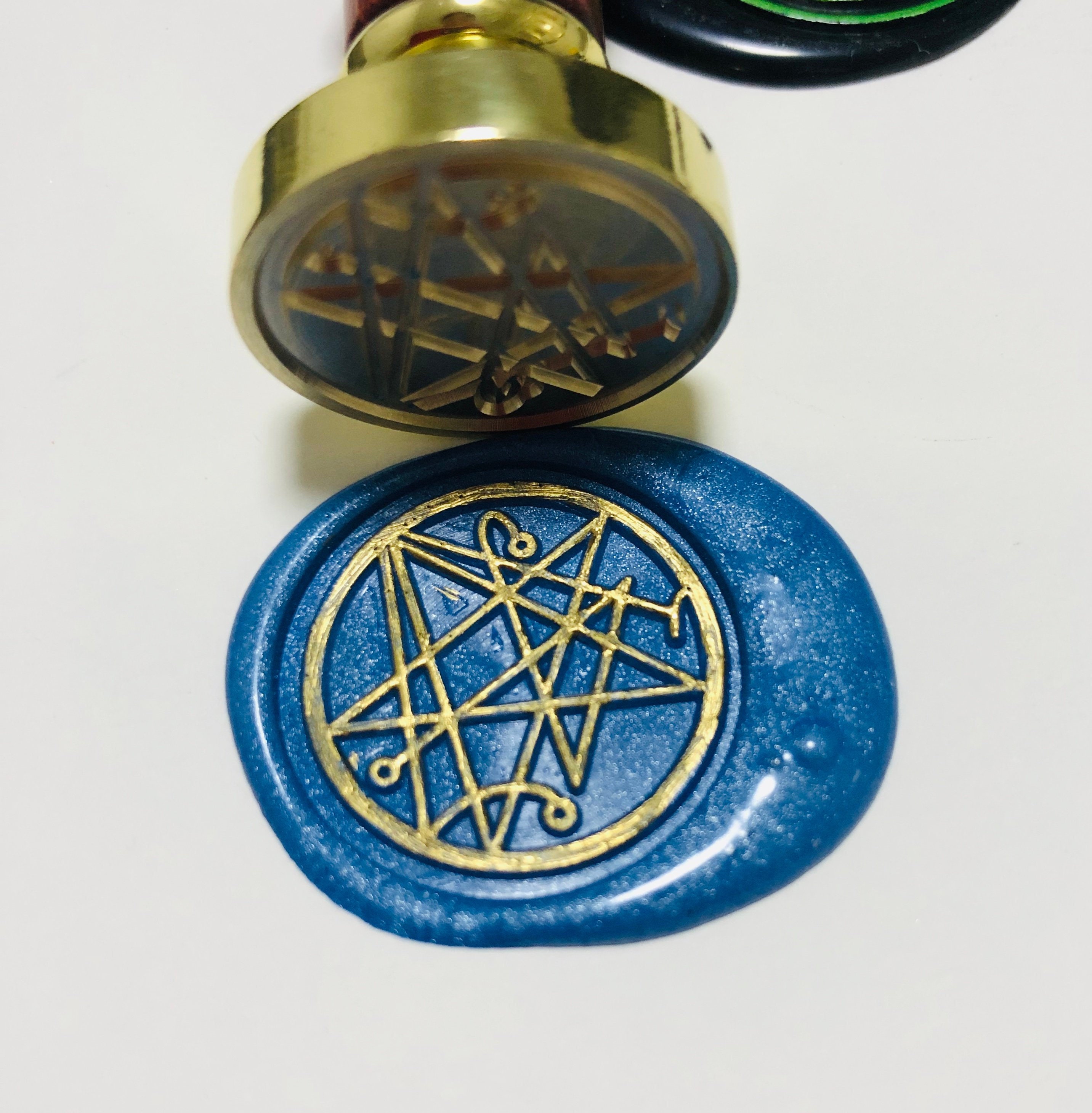 the Necronomicon seal wax stamp from Cthulhu Mythos, Call of Cthulhu, Lovecraft