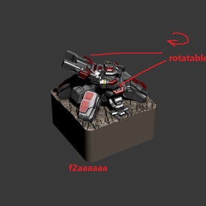 May include: A black and red detailed robot model with a rotating turret. The robot is standing on a brown base.
