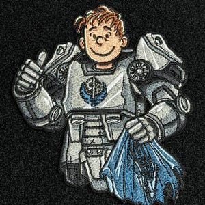 May include: Embroidered patch featuring a cartoon character in silver and white armor, giving a thumbs up. The character holds a blue object. The patch has a black background and is likely for a video game or sci-fi theme.