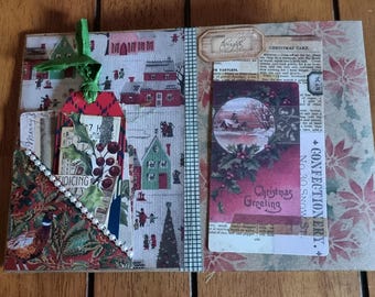 May include: A handmade Christmas journal with a red and green floral pattern on the cover. The journal has a pocket on the front cover with a green ribbon bookmark. The inside pages are decorated with vintage Christmas images and ephemera.