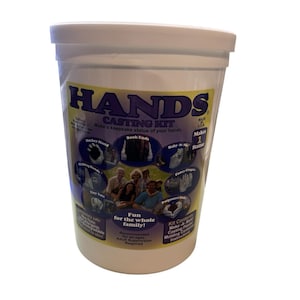 May include: A white plastic container with a lid, labeled "HANDS CASTING KIT." The kit includes instructions and materials to make a keepsake statue of hands. The label features images of hand sculptures and text: "Fun for the whole family!"