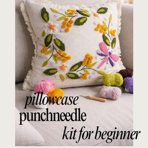 May include: A white ceramic mug with a black handle and the text "But First, Coffee" in a black, handwritten-style font. The mug is on a white surface.