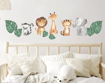 May include: A set of six watercolour animal wall decals featuring a lion, giraffe, tiger, elephant, lemur, and tropical leaves. The decals are perfect for adding a touch of whimsy to a child's room or nursery.