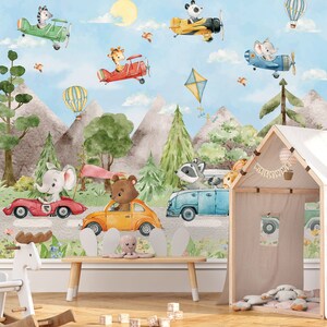 May include: A colorful children's room mural featuring animals driving cars and flying airplanes. The mural includes a giraffe, zebra, panda, raccoon, bear, and elephant. The mural is set against a backdrop of mountains, trees, and a blue sky. The text "Welcome" is displayed on a small wooden playhouse.