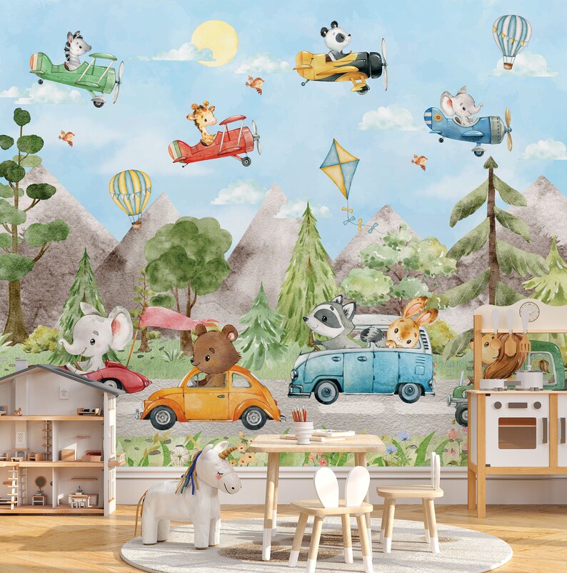 May include: A colorful children's room mural featuring animals driving vehicles. The mural depicts a blue van with a raccoon and rabbit, a yellow car with a bear, a red car with an elephant, and a blue airplane with a mouse. The mural also features a hot air balloon, a kite, and a yellow airplane with a panda.