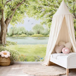 Gender neutral nursery featuring tree canopy and peaceful lake mural