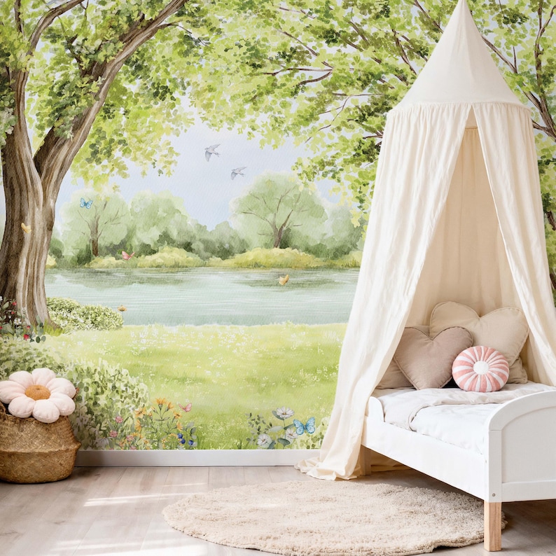 Gender neutral nursery featuring tree canopy and peaceful lake mural