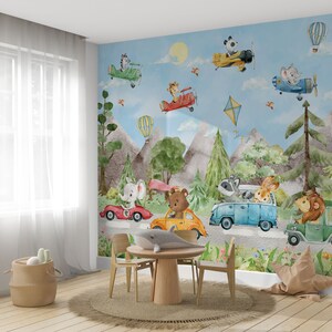 May include: A whimsical nursery wall mural featuring a blue sky with clouds, mountains, and trees.  Animals, including a bear, elephant, raccoon, lion, and rabbit, are driving cars and airplanes.  The mural is perfect for a child's bedroom or playroom.