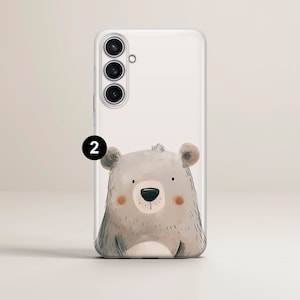 May include: A clear phone case with a cute cartoon bear illustration. The bear is gray with a brown nose and brown eyes. The phone case has a camera cutout with three lenses.