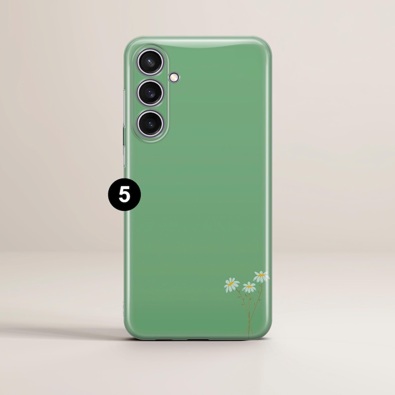 May include: A green phone case with a daisy floral design. The case has a glossy finish and features a camera array on the upper left. The number "5" is printed on the lower left.