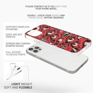May include: A clear phone case with a red and white graphic of many eyes. The case is designed to fit an iPhone 13 Pro Max. The text "PLEASE CONTACT US IF YOU DON'T FIND YOUR PHONE MODEL" and "DOUBLE - CHECK YOUR ADDRES AND PHONE MODEL BEFORE ORDERING" is printed on the white background.