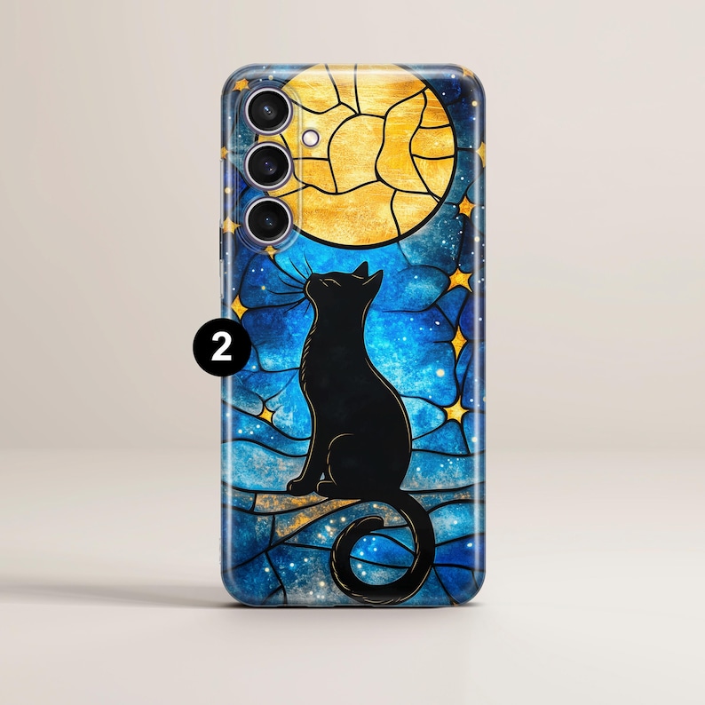 May include: A black cat silhouette looking up at a yellow moon in a stained glass style phone case. The background is a blue and black starry night.