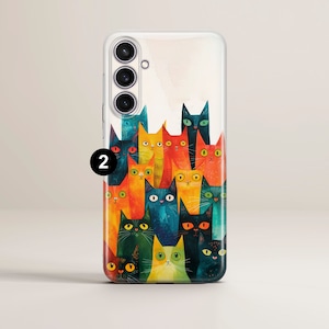 May include: A clear phone case with a colorful illustration of a group of cats. The cats are stacked on top of each other and have different colors and patterns. The phone case has a camera cutout on the back.