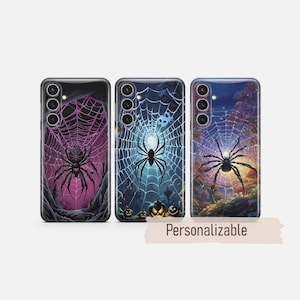 May include: Three smartphone cases featuring spider and web designs. The left case has a purple web and spider, the centre case shows a blue web with pumpkins and a skull, and the right case displays a spider on a web against a sunset forest scene.
