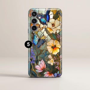 May include: A phone case featuring a stained-glass design with butterflies and flowers. The case has a colorful floral pattern with blue butterflies, yellow and white flowers, and the number "5" in a black circle.
