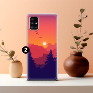 May include: A clear phone case with a sunset scene over mountains and trees. The case has a purple, orange, and pink gradient background with a silhouette of trees and mountains. The sun is setting in the distance.