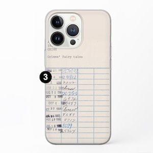 May include: A clear phone case with a white background and a library card design. The card has black lines and blue handwritten text that includes dates and numbers. The text reads "Grimms' Fairy tales".