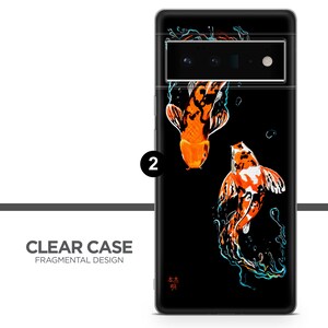 May include: Clear phone case with a black background and two orange and white koi fish swimming in a blue and green water design. The text "本" and "明" are in the bottom right corner of the case.