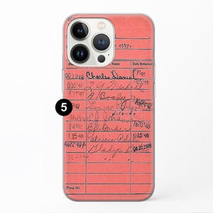 May include: A pink library card with handwritten names and dates. The card has a number "5" circled in black marker on the left side. The card has the text "(Form 16)" at the bottom.