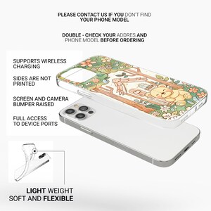 May include: A clear phone case with a colorful illustration of a house in a forest with a bear sitting on the porch. The text "PLEASE CONTACT US IF YOU DON'T FIND YOUR PHONE MODEL" and "DOUBLE - CHECK YOUR ADDRES AND PHONE MODEL BEFORE ORDERING" is printed on the image. The case supports wireless charging, has a raised bumper, and has full access to device ports.