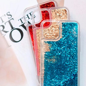 May include: Three clear phone cases with glitter inside. The top case has red glitter, the middle case has gold glitter, and the bottom case has blue glitter.