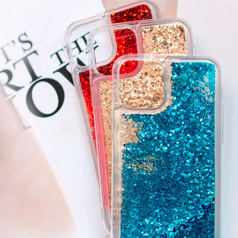 May include: Three clear phone cases with glitter inside. The top case has red glitter, the middle case has gold glitter, and the bottom case has blue glitter.