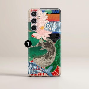 May include: A phone case with a colorful design featuring a lotus flower, fish, and a moon. The case has a cutout for the camera lens and a white background.