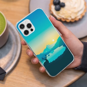 May include: A clear phone case with a colorful landscape design. The case features a blue sky, green mountains, and a lake with a deer silhouette. The case is designed for a phone with a triple camera system.