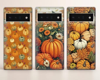 May include: Three phone cases with different autumn-themed designs. The first case features a repeating pattern of pumpkins and leaves on a brown background. The second case features a large orange pumpkin with smaller pumpkins and flowers on a green background. The third case features a variety of pumpkins and leaves on a brown background.