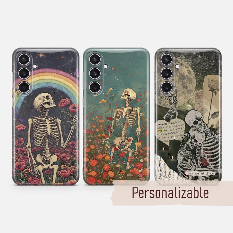 May include: Three phone cases with different designs featuring skeletons and flowers. The first case has a rainbow and a skeleton holding a flower. The second case has a skeleton holding a flower in a field of flowers. The third case has two skeletons embracing with a moon and text that says "I want you. All of you".