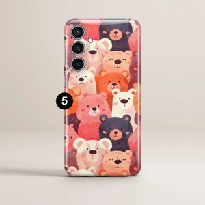 May include: A phone case with a colorful pattern of cartoon bears. The bears are in various colors, including pink, red, brown, and black. The case has a clear back and a raised camera bump.