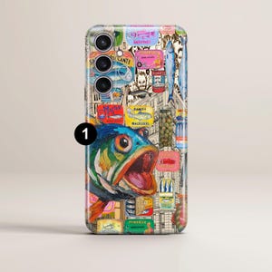 May include: A phone case with a vibrant design showcasing a fish illustration alongside images of canned sardines and other seafood. The artwork incorporates text elements and a cityscape backdrop, creating a unique aesthetic.