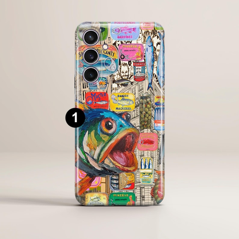 May include: A phone case with a vibrant design showcasing a fish illustration alongside images of canned sardines and other seafood. The artwork incorporates text elements and a cityscape backdrop, creating a unique aesthetic.