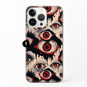 May include: A clear phone case with a design of red eyes on a black background. The eyes are drawn in a graphic style and appear to be dripping with black liquid.