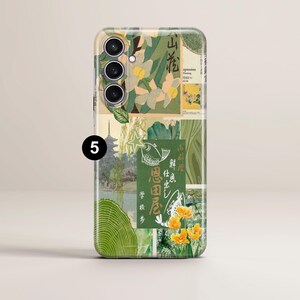 May include: A green, white, and yellow phone case with a collage of Japanese-inspired designs, including flowers, fish, and text. The case has a camera cutout with three lenses.