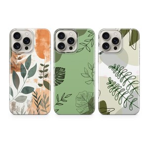 May include: Three phone cases with different designs featuring abstract shapes and line drawings of leaves. The cases are clear with a white background and have a green, orange, and white color scheme.