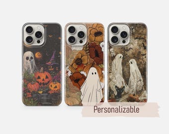 May include: Three smartphone cases featuring Halloween designs. The left case shows ghosts and jack-o'-lanterns. The center case displays a ghost with orange flowers and text. The right case depicts ghosts, a black cat, and bats. Text reads Personalizable.